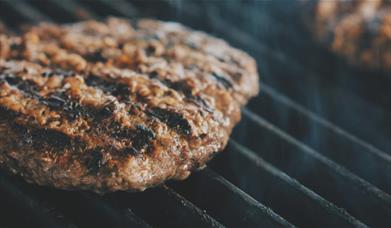 Meat on the grill at Tebay Services Farmshop and Kitchen in Tebay, Cumbria