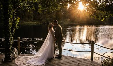 Bridal Couple Posing at Sunset at a Wedding at The Gilpin Hotel & Lake House in Windermere, Lake District