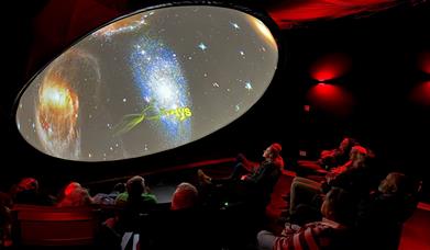 Visitors watching a display at the Grizedale Observatory in the Lake District, Cumbria