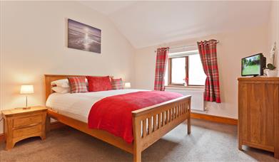 One of the double bedrooms in Hollins Cottage at Hollins Farm Holiday Park