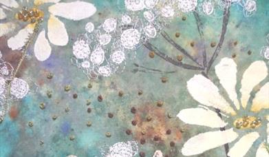 Mixed media artwork on fabric featuring layered painted background with floral motifs