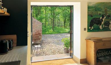 Double doors leading outside at The Barn at Linden Farm House in Langwathby, Cumbria