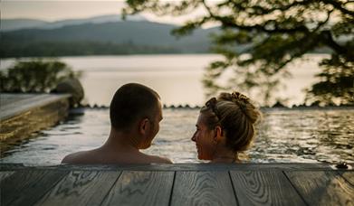 Couple in Infinity Pool at The Spa at Low Wood Bay Resort in Windermere, Lake District