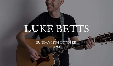 Luke Betts playing guitar