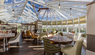 Dining Tables and Seating at The Conservatory at The Melbreak Hotel in Great Clifton, Cumbria