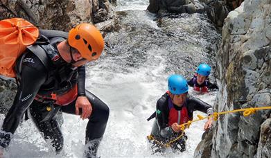 Visitors Extreme Ghyll Scrambling and Canyoning with Path to Adventure in Eskdale, Lake District