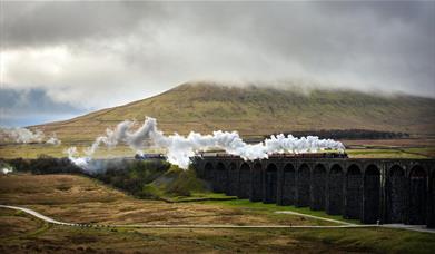 Steam Train on The Settle - Carlisle Railway line in Cumbria, UK