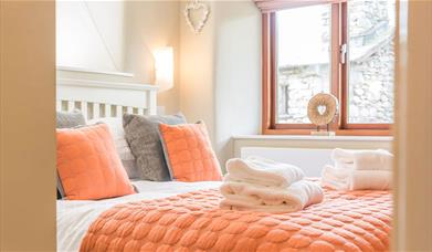 Double Bedroom and Folded Towels in The Byre at The Yan in Grasmere, Lake District