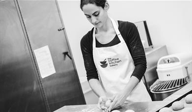 Black and White Photo of a Baker at The Coffee Kitchen Bakery in Cockermouth, Cumbria