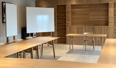 Meeting room layout with whiteboards at The Hub at The Heaning Estate in Windermere, Lake District