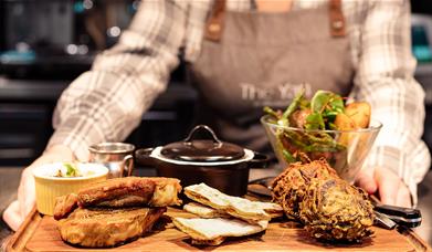 Server Carrying a Food Platter at The Yan at Broadrayne in Grasmere, Lake District