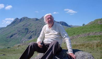 Photo of Alfred Wainwright atop a Cumbrian fell