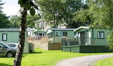 Exteriors of holiday homes for sale at Waterfoot Park in Pooley Bridge, Lake District