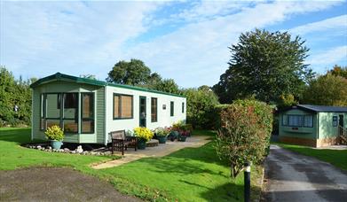 Caravan exteriors at Woodclose Caravan Park in Kirkby Lonsdale, Cumbria