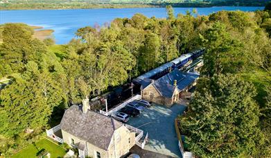 Aerial Photo of Bassenthwaite Lake Station & Carriage Cafe, with Bassenthwaite Lake in the Background, in the Lake District, Cumbria