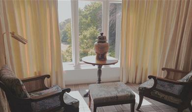 Bedroom seating and scenic view at Ambleside Manor Vegetarian Guest House in Ambleside, Lake District