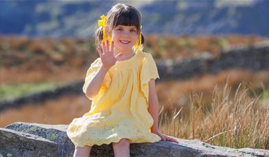Photo of a child in a scenic Lake District location with Anna Bailey Photography