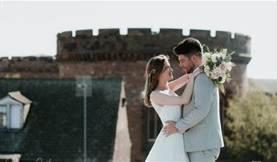 Bridal Couple posing for a photo near The Halston in Carlisle, Cumbria