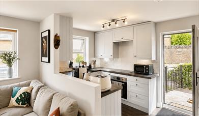 Kitchen and living room in Scarpa from Muddy Boots Escapes in Kirkby Stephen, Cumbria