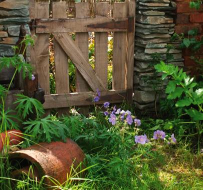 Garden plants and decor at The Peter Rabbit Garden at The World of Beatrix Potter in Bowness-on-Windermere, Lake District