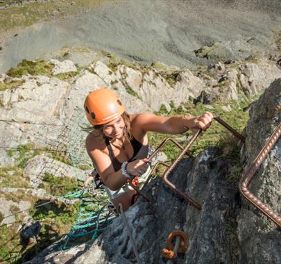 Climber at Via Ferrata Xtreme at Honister Slate Mine in Borrowdale, Lake District