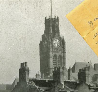 Black and white photo of a Church with a hand written letter sitting on on top of said photo