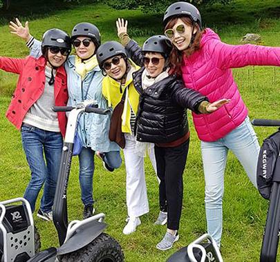 Visitors enjoying an experience with Lakeland Segway in Cartmel, Lake District