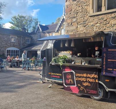 Outdoor food truck serving smash burgers