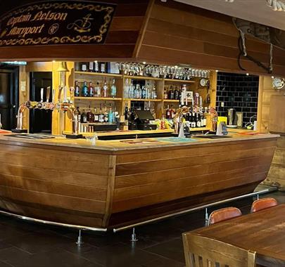 Nautical themed bar shaped like a ship's stern at Captain Nelson Tavern in Maryport, Cumbria