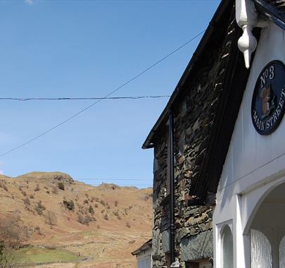 Exterior of No. 3 Main Street and View of Loughrigg Fell in Elterwater, Lake District