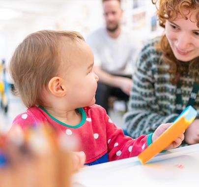 A baby and a women playing together
