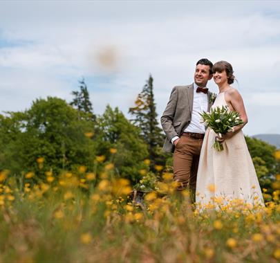 Happy Couple Posing for Wedding Photos at Armathwaite Hall Hotel and Spa in Bassenthwaite, Lake District