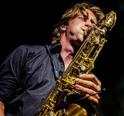 A member of the Jack Pearce Quartet playing Saxophone on stage
