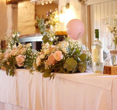 Head Table Decorations for a Wedding at Crooklands Hotel in Milnthorpe, Cumbria
