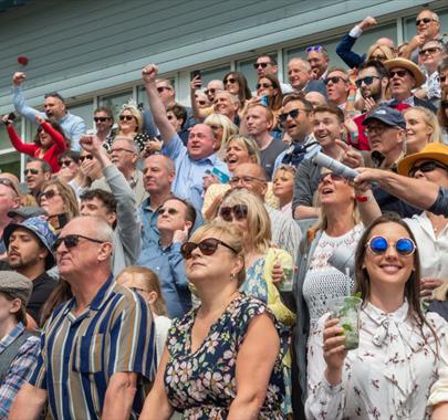 Crowd Cheering at the Cartmel Racecourse 2024 Race days at Cartmel Racecourse in Cartmel, Cumbria