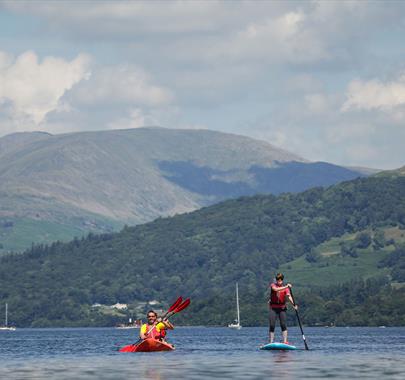 Visitors Kayaking and Paddleboarding at Windermere Canoe Kayak in the Lake District, Cumbria