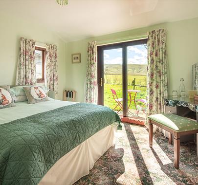 Double Bedroom with Dressing Table and Outdoor Access at High Greenside Bed and Breakfast in Ravenstonedale, Cumbria