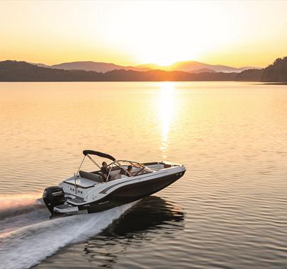 Boat on a Lake at Sunset, from Freedom Boat Club Windermere in Bowness-on-Windermere, Lake District