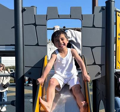 Child on the Shiver Me Timbers playground at Lake District Coast Aquarium in Maryport, Cumbria