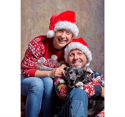 Couple and Dog at the Santa Paws Festive Photo Studio at Fell Foot, Lake District