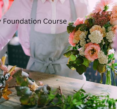 Florist making a colourful bouquet, with the words "Floristry Foundation Course"