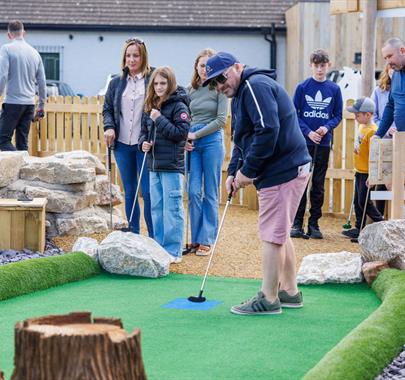 Family Playing at Foxy's Adventure Golf in Penrith, Cumbria