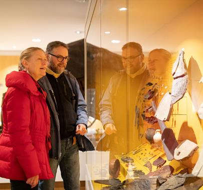 Visitors at the Roman Museum on the Hadrian’s Wall Edge of Empire Tour with Great Guided Tours