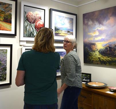 Visitors viewing Art on Display at Gallery North West in Brampton, Cumbria