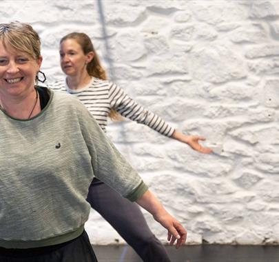 a group of ladies dancing in a studio