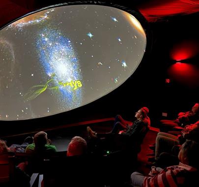 Visitors watching a display at the Grizedale Observatory in the Lake District, Cumbria