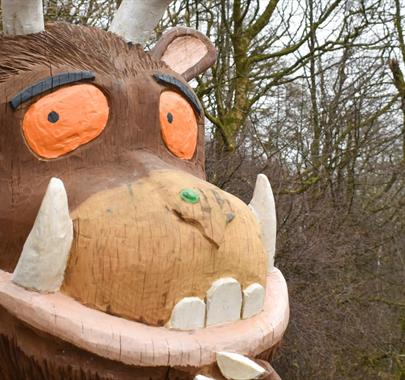 photo of the Gruffalo with a forest in the background