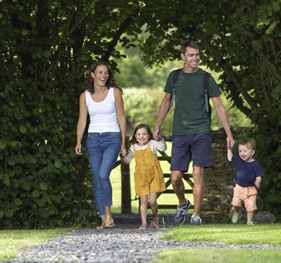 Family Walking at Hollins Farm Holiday Park in Far Arnside, Cumbria