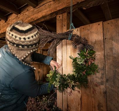 Person making a wreath