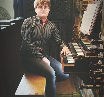 Igor Sikorski sat by an organ